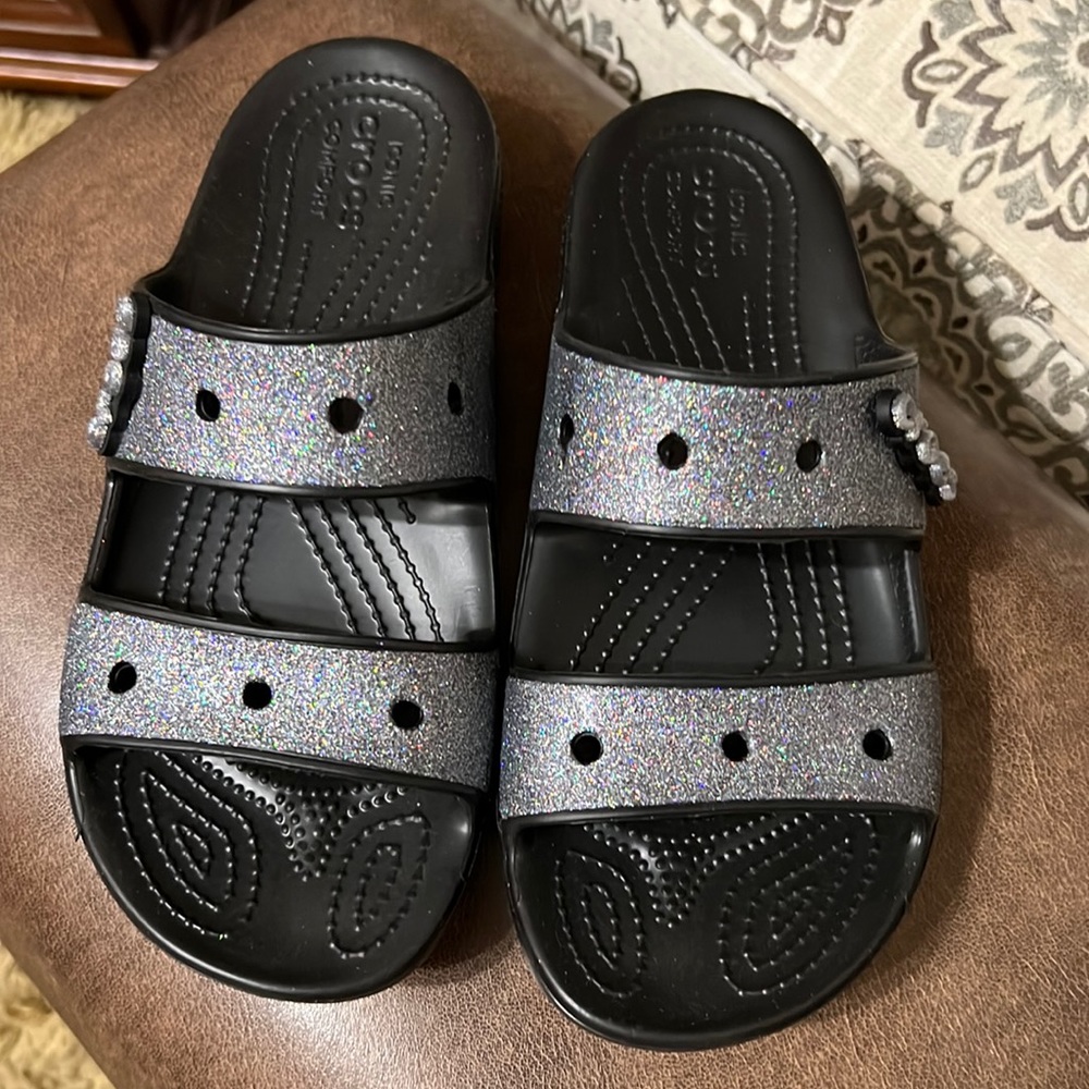 Black two strap Black Crocs with Charm and Glitter. NWOT.